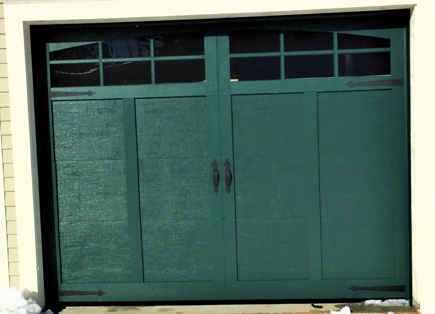 Green Carriage Style Door With 6-Pane Arched Glass And Decorative Hardware