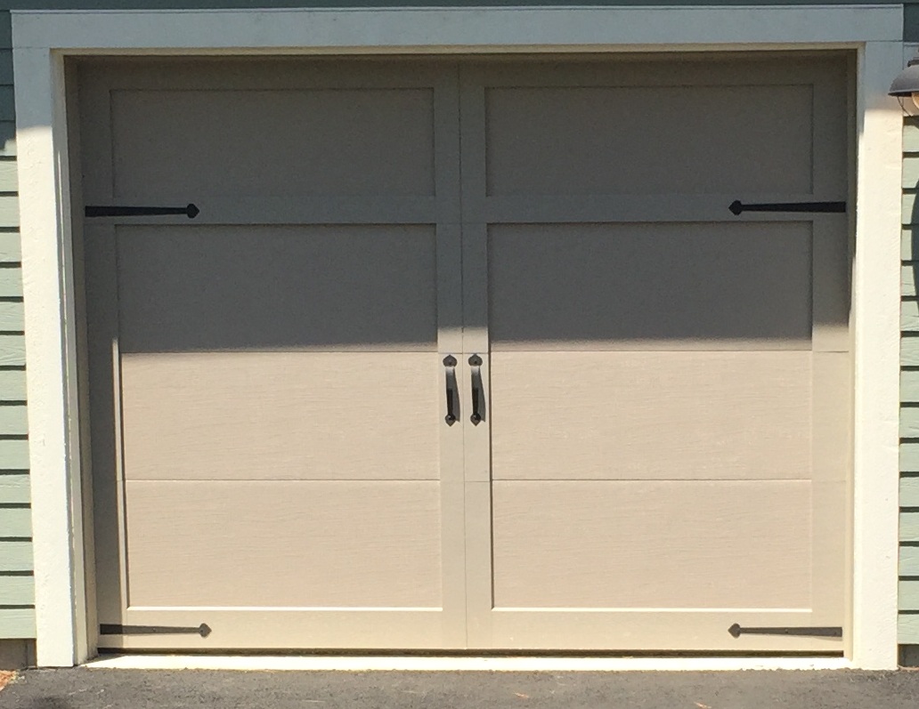 Solid Carriage Style Door With Decorative Hardware