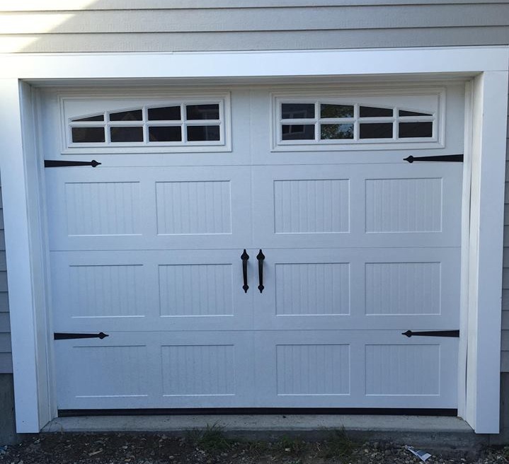 Stamped Carriage Design With Arched 8-Pane Glass Inserts